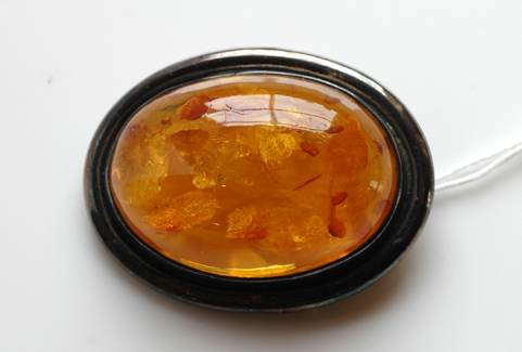 Appraisal: AMBER BROOCH SET IN SILVER