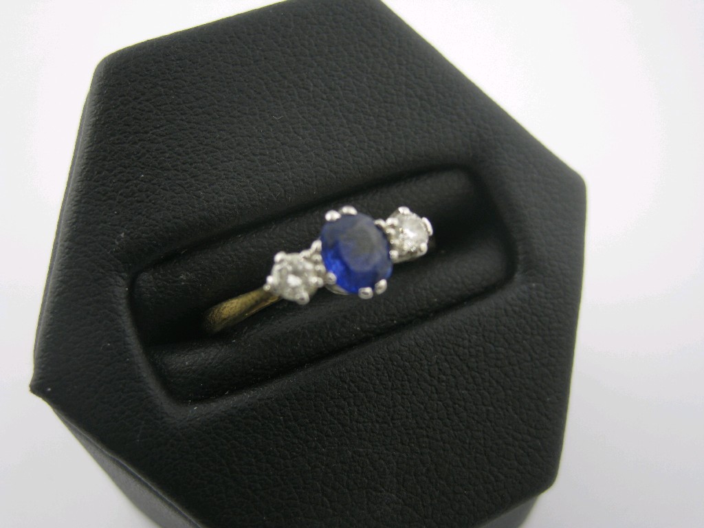 Appraisal: A Sapphire and Diamond three stone Ring claw set central