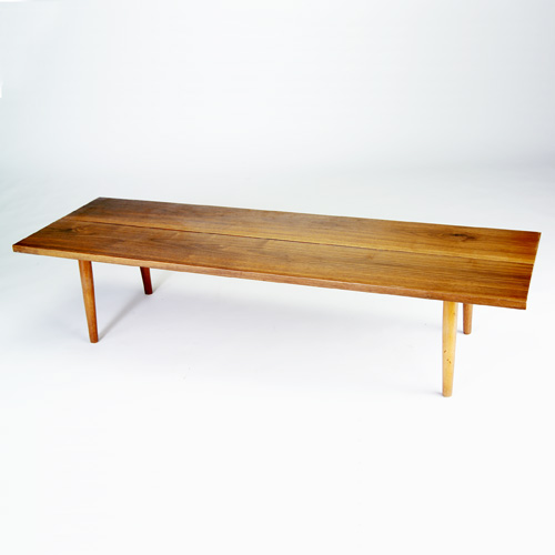 Appraisal: GEORGE NAKASHIMA Early black walnut coffee table on tapering dowel