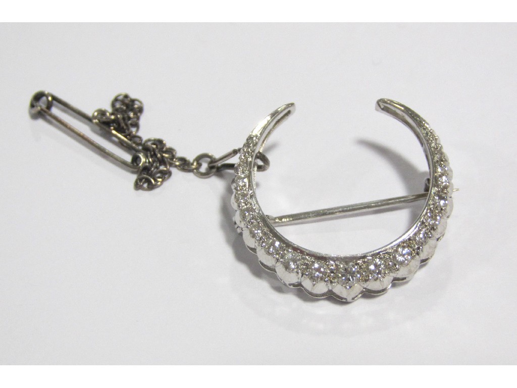 Appraisal: A white metal diamond set crescent shaped brooch x mm