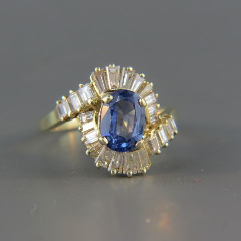 Appraisal: Sapphire Diamond Ring elegant blue oval gem weighing carat surrounded