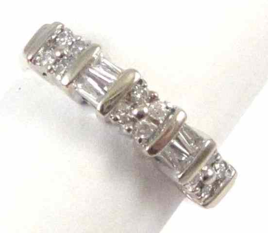 Appraisal: DIAMOND AND FOURTEEN KARAT WHITE GOLD RING set with twelve