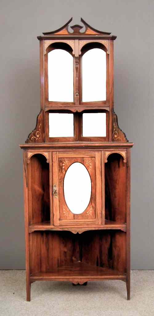 Appraisal: A late Victorian rosewood corner cupboard inlaid with boxwood stringings