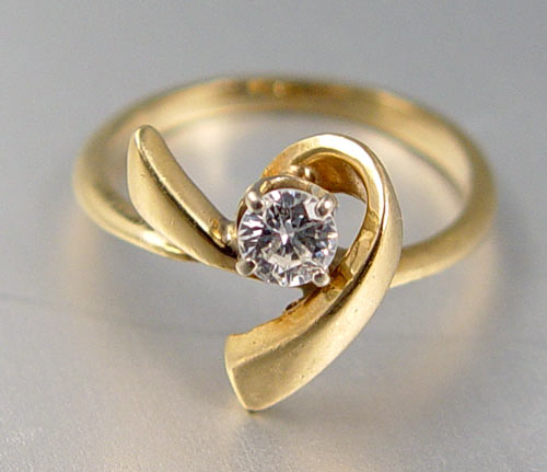 Appraisal: K CT DIAMOND SOLITAIRE RING Asymmetrical contemporary K yellow gold