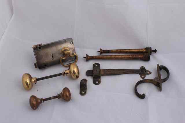 Appraisal: A GROUP OF GEORGIAN AND LATER BRASS LOCKS door handles