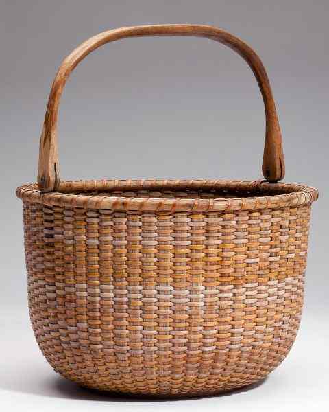 Appraisal: Vintage Nantucket Lightship Basketmold woven rounded form with swing handle