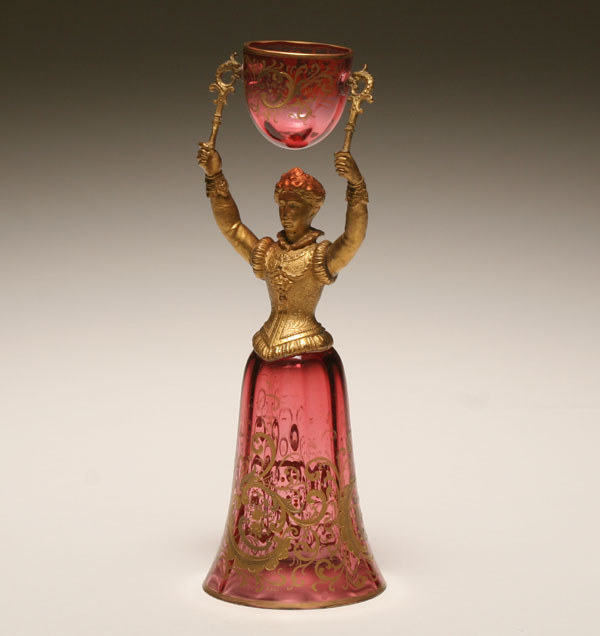 Appraisal: German gilt metal and enameld glass figural wedding cup in