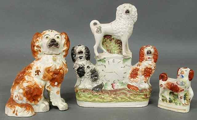 Appraisal: Three th c Staffordshire dog including a red spaniel with