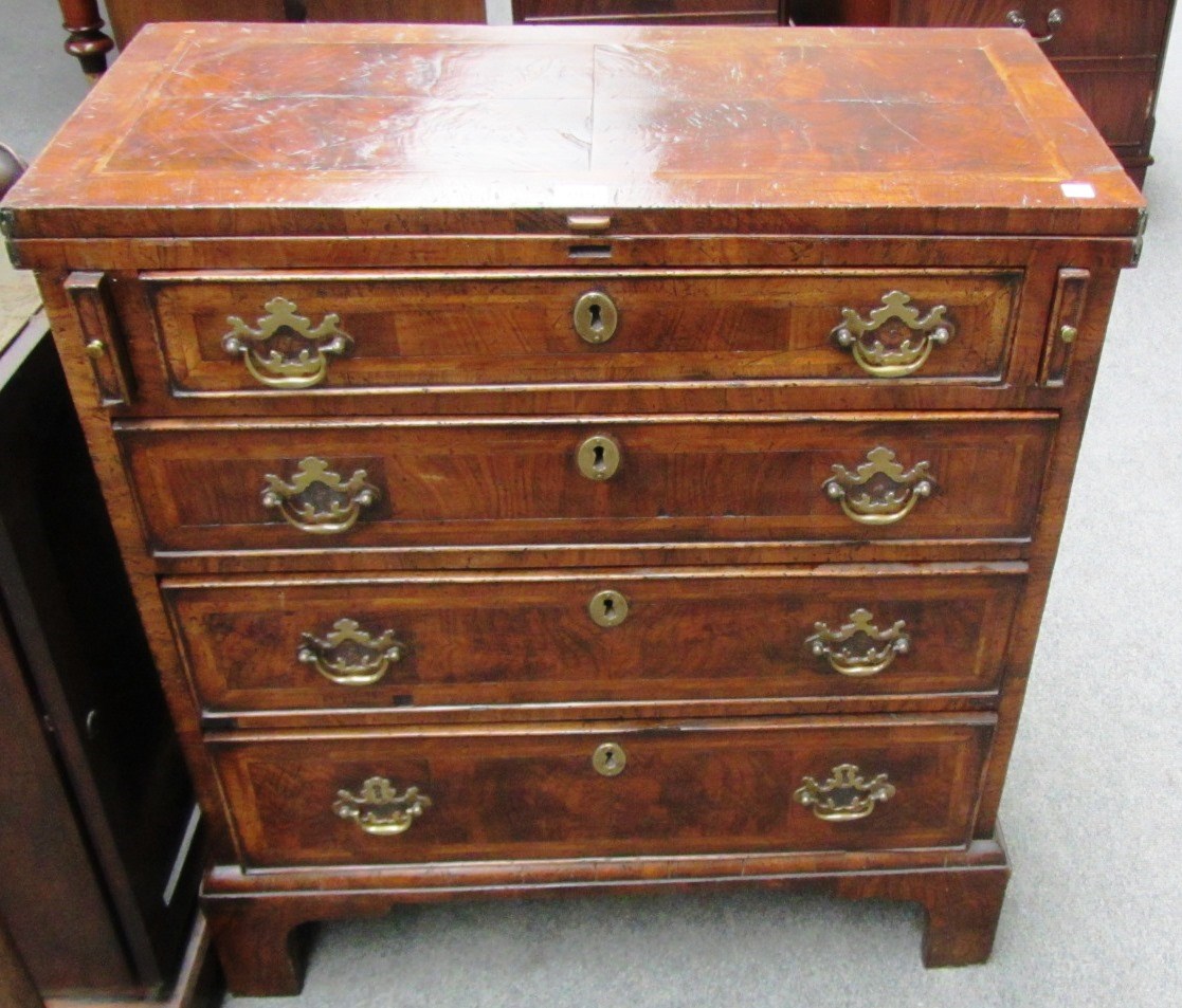 Appraisal: A made up th century figured walnut batchelors chest the