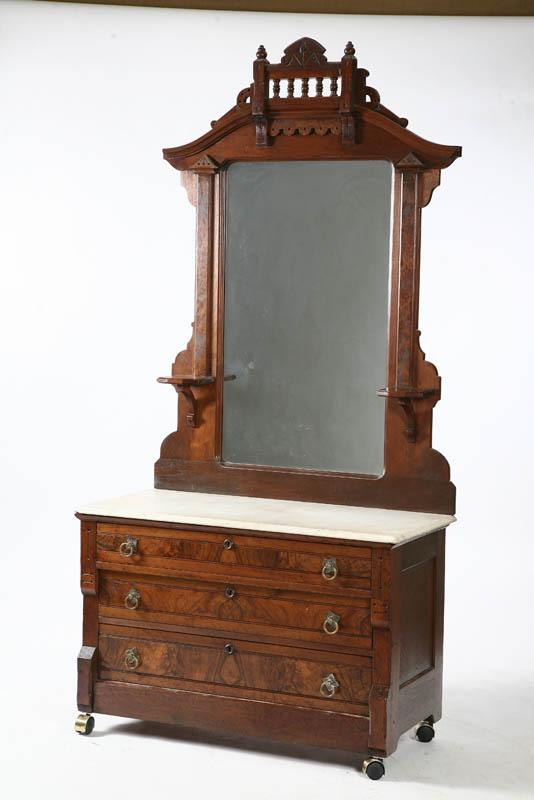 Appraisal: VICTORIAN MARBLE TOP CHEST Walunt with a banister carved wing