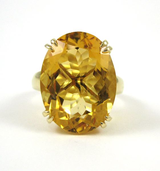 Appraisal: FOURTEEN KARAT GOLD AND CITRINE RING ct oval mixed-cut citrine