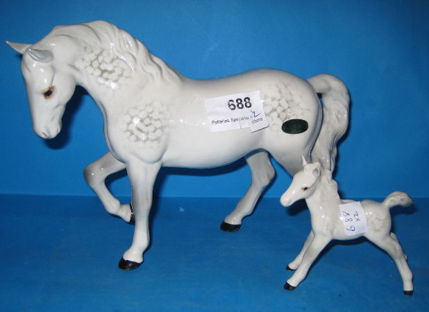 Appraisal: Beswick Stocky Jogging Mare And Small Stretched Foal Facing Left