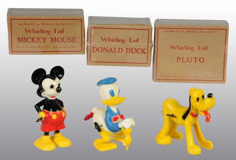 Appraisal: Lot of Plastic Walt Disney Whirling Tail Toys Description American