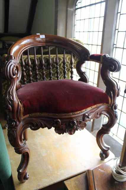 Appraisal: A VICTORIAN MAHOGANY HORSESHOE SHAPED BACKED ARMCHAIR with scrolled arms