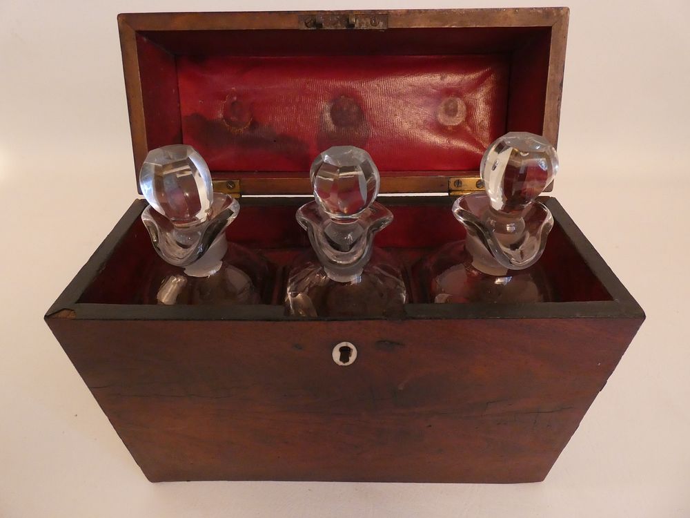 Appraisal: ANTIQUE BOTTLE DECANTER SET Empire period mahogany cased decanter set