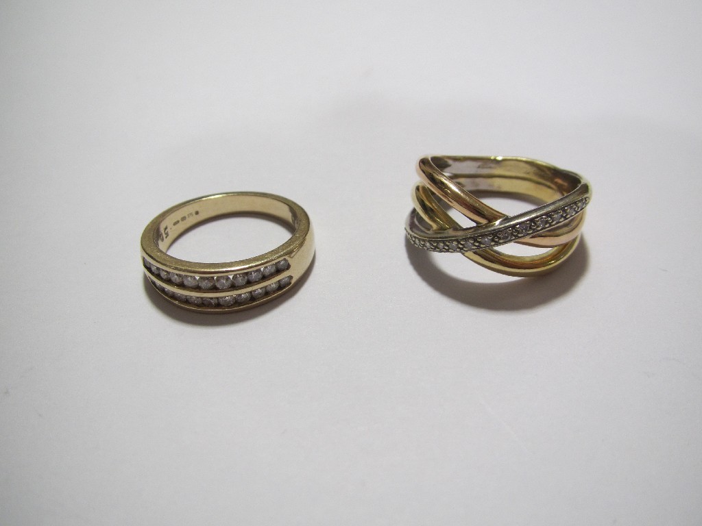 Appraisal: An ct triple rail cross over ring set with a