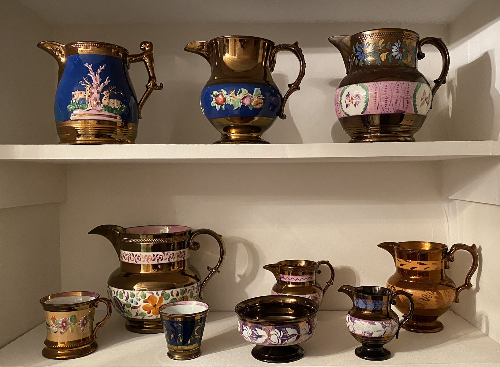 Appraisal: PIECE LOT COPPER LUSTER PITCHERS AND CREAMERS A piece collection