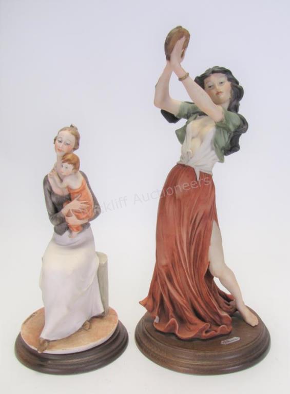 Appraisal: Two Giuseppe Armani Resin Figures one depicting a woman playing