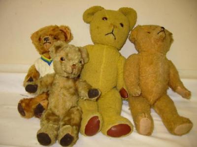 Appraisal: Four various English teddy bears all plush covered with amber