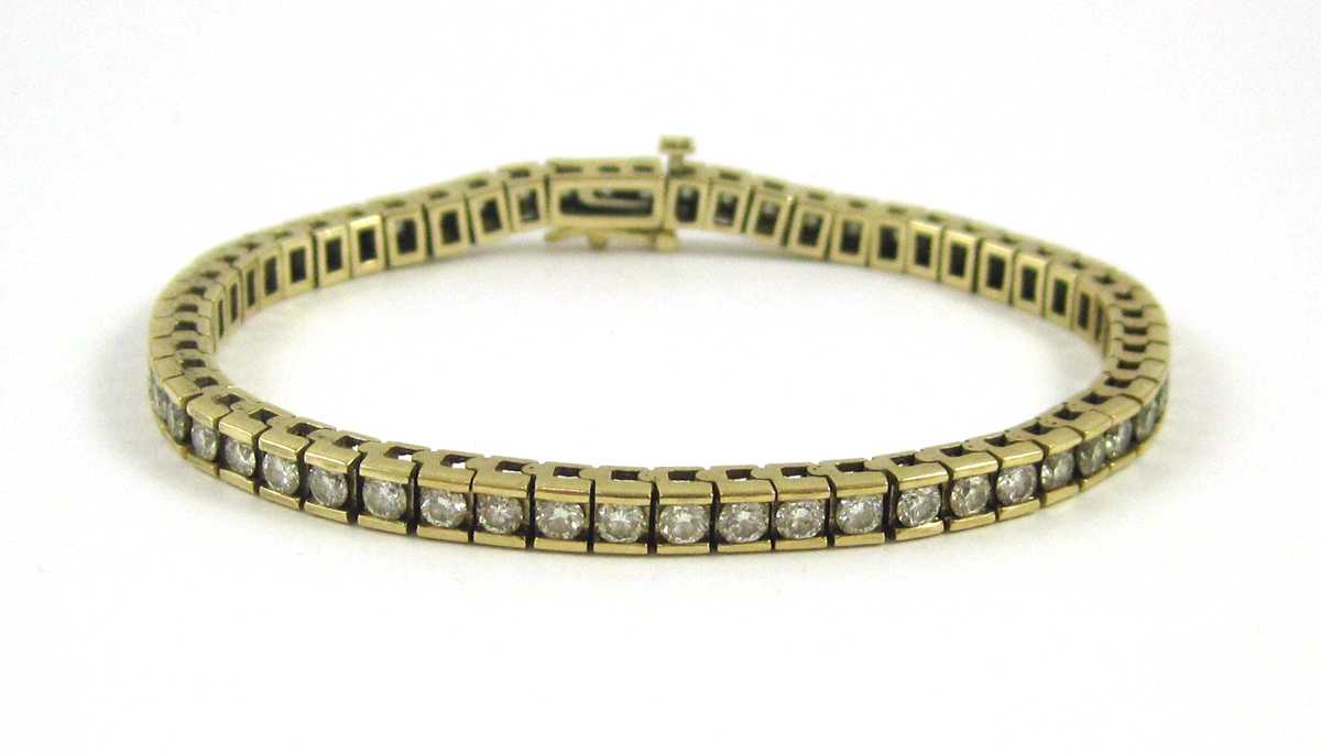 Appraisal: DIAMOND AND FOURTEEN KARAT GOLD TENNIS BRACELET measuring - inches