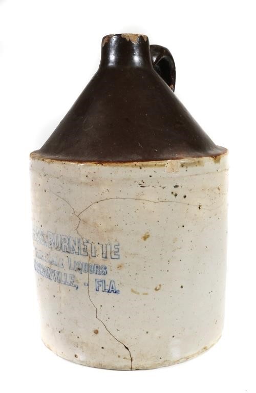 Appraisal: Chas Burnette Wholesale Liquors jug Circa late s Chips and