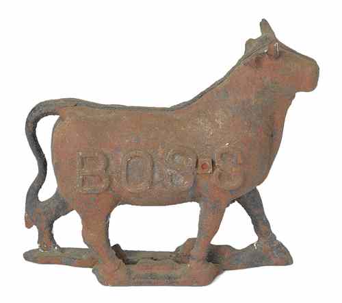 Appraisal: Cast iron bull mill weight th c embossed Boss h