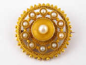 Appraisal: An antique carat gold untested pearl brooch the central pearl