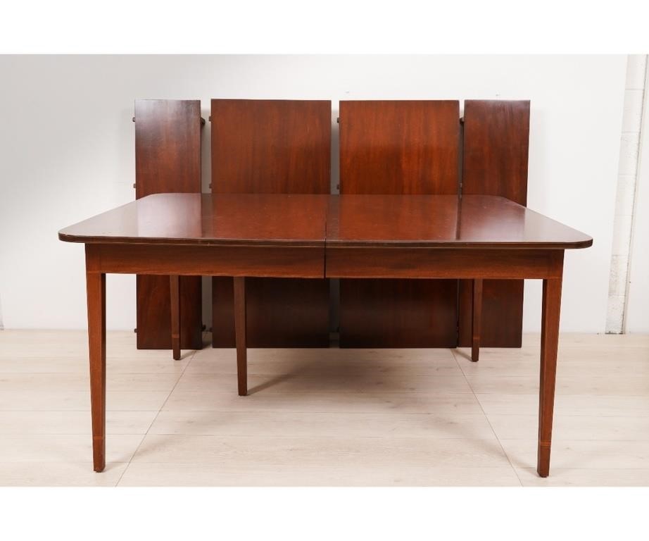 Appraisal: Hepplewhite style mahogany inlaid dining room table with four leaves