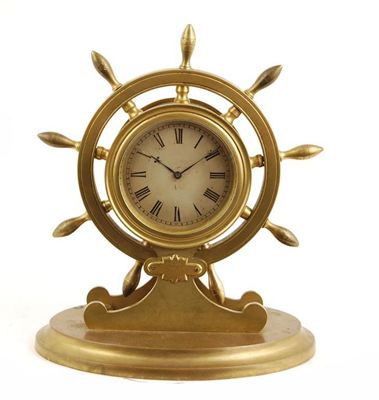 Appraisal: A gilt brass 'ships wheel' clock with a platform cylinder