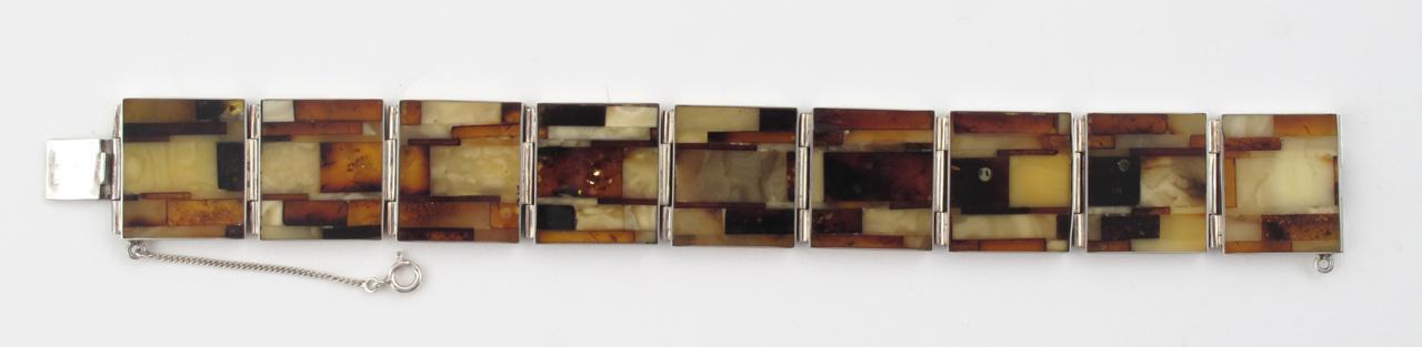 Appraisal: A silver mounted amber and bakelite bracelet