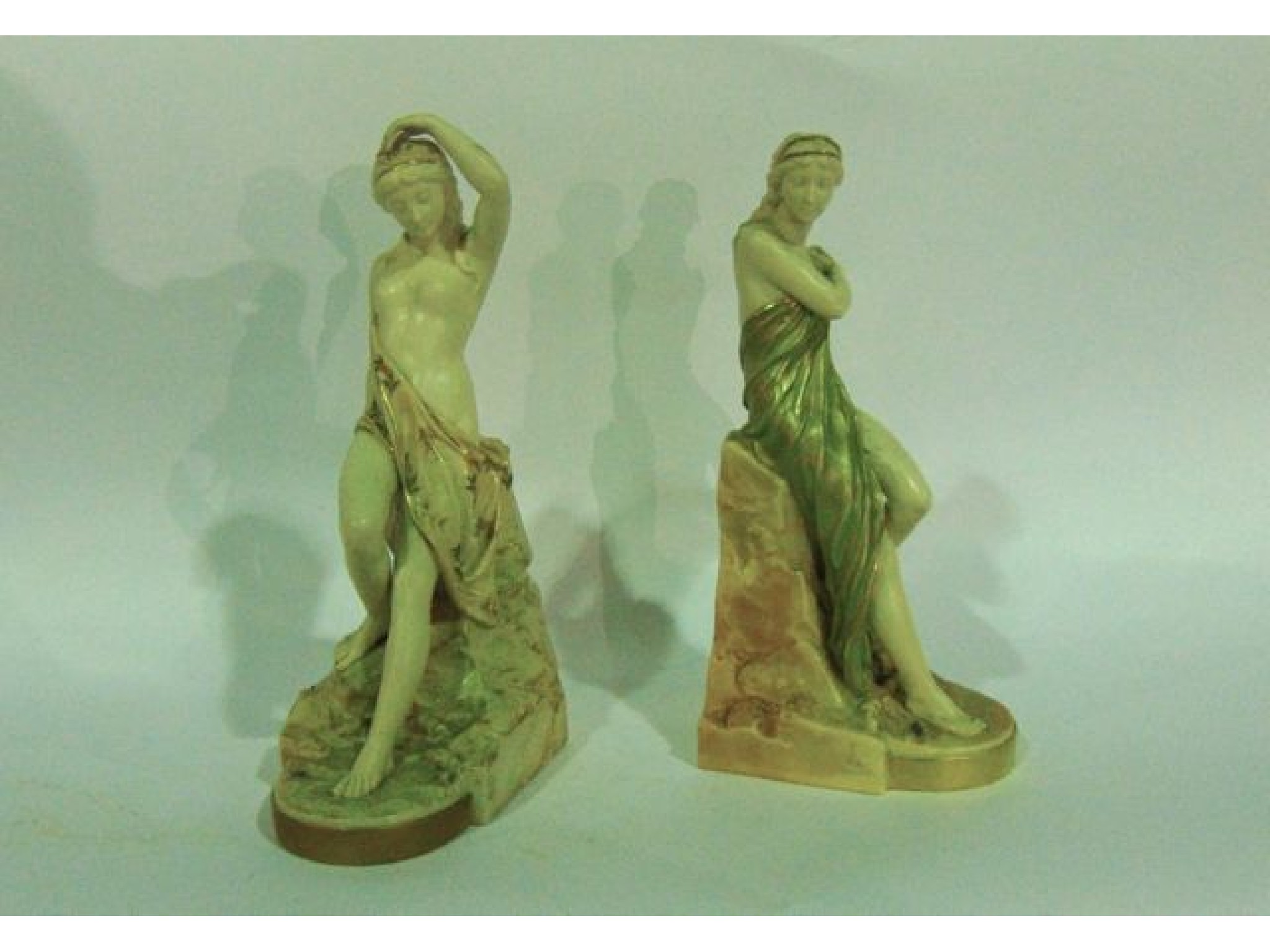 Appraisal: A matched pair of Royal Worcester figures with predominantly ivory