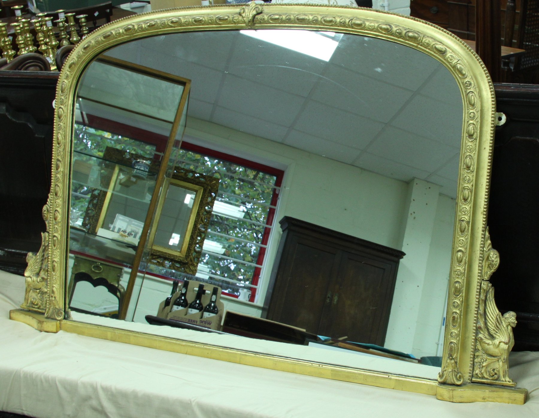 Appraisal: A Victorian gilt-gesso overmantel mirror circa arched with sphinx brackets