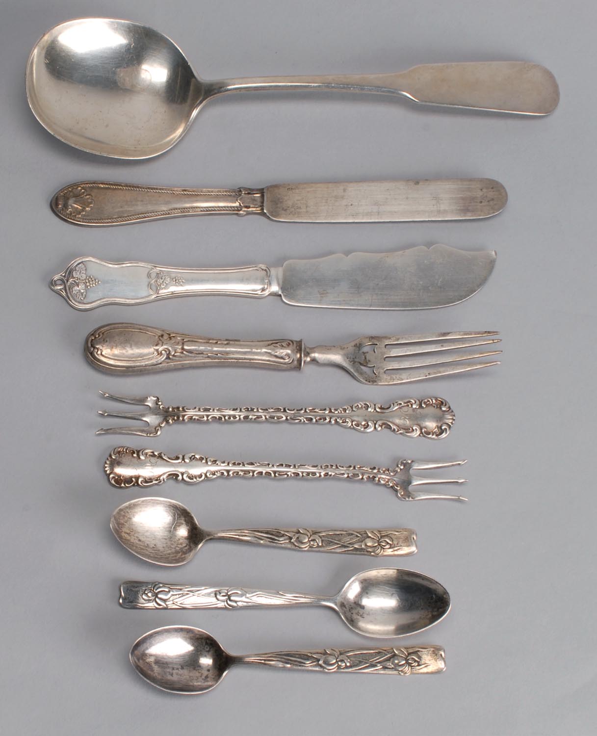 Appraisal: NINE SILVER ITEMS two sterling silver oyster forks three Tiffany