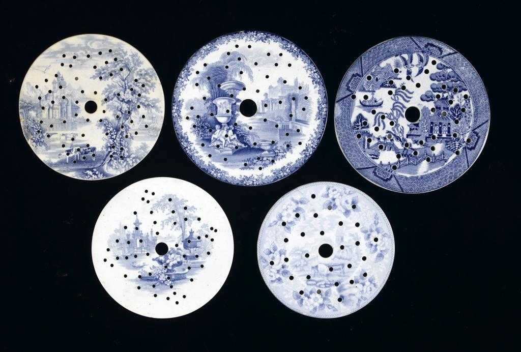 Appraisal: FIVE BLUE PRINTED EARTHENWARE AND STONE CHINA CIRCULAR DRAINERS Cattle