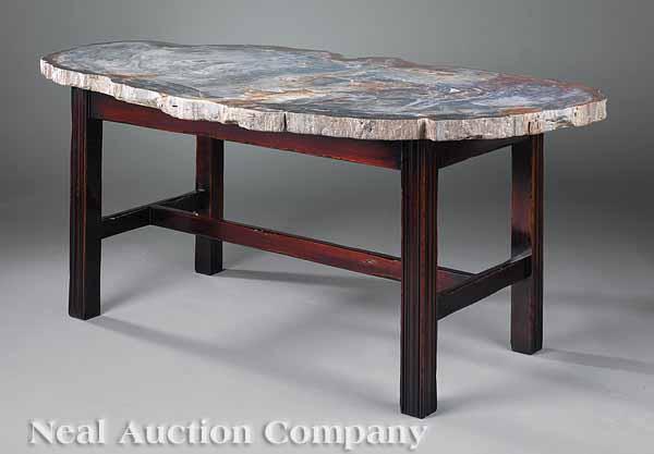 Appraisal: A Triassic Period Fossilized Wood Low Table the one-inch thick