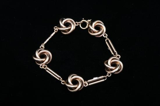 Appraisal: YELLOW GOLD LOVE KNOT DESIGN FLEXIBLE LINK BRACELET Five knots