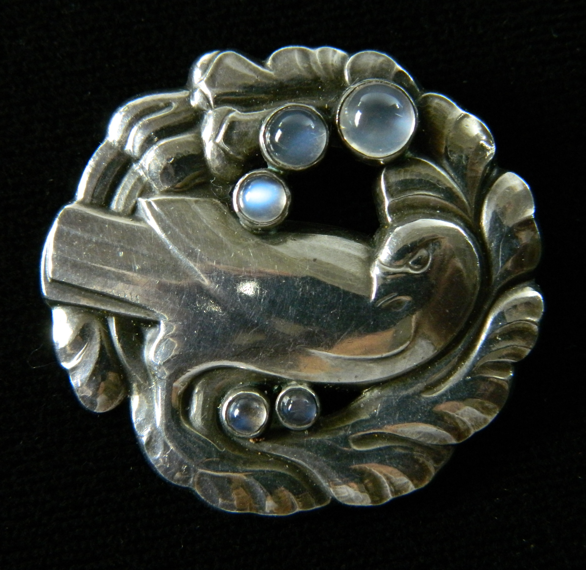 Appraisal: Georg Jensen sterling silver brooch with in-set moonstone cabachons Bird