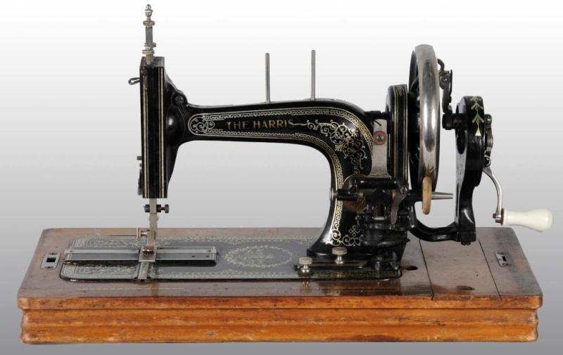 Appraisal: Harris Sewing Machine Description Circa Working Fancy with intricate gold