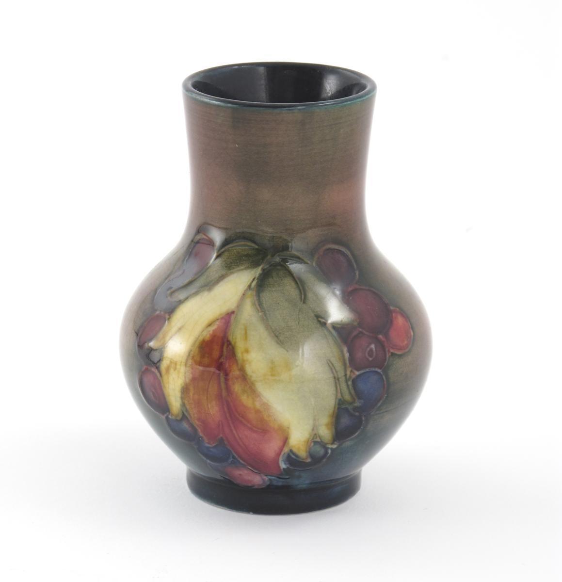 Appraisal: Leaf and Berry a Moorcroft Pottery vase designed by William