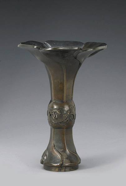 Appraisal: A cast bronze floriform vase th Century Articulated as a