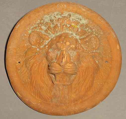 Appraisal: Round terracotta lion head mask dia