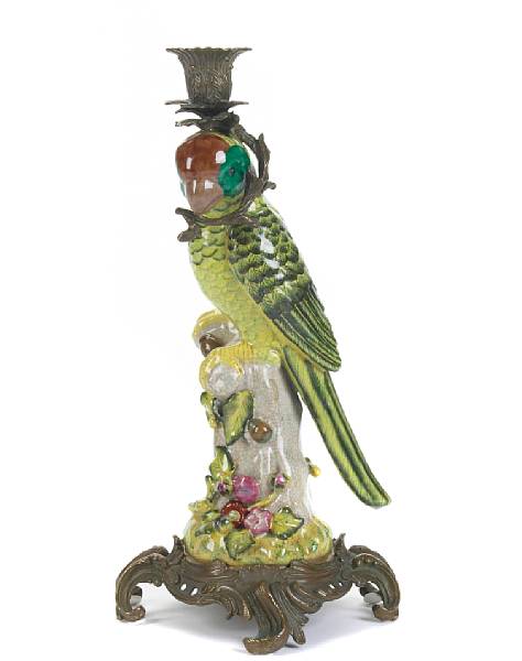 Appraisal: A pair of glazed earthenware and gilt metal parrot form