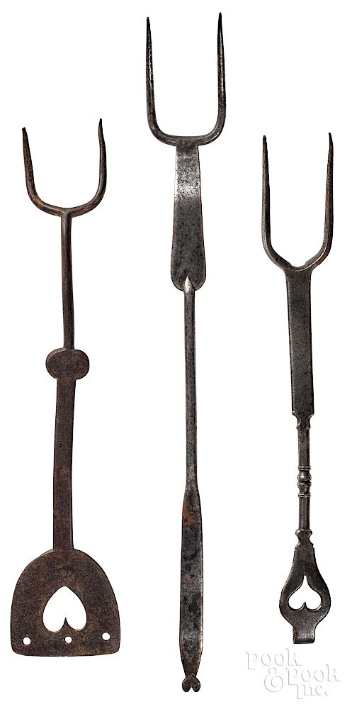 Appraisal: Three wrought iron utensils Three wrought iron utensils with heart