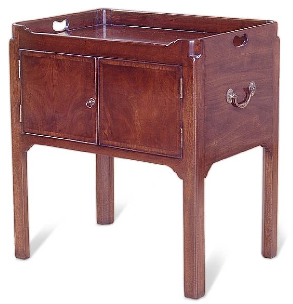 Appraisal: A George III style mahogany bedside cupboard The galleried top