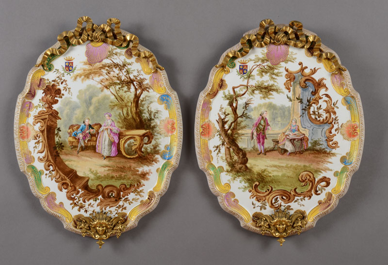 Appraisal: PAIR OF R GENCE STYLE GILT-METAL MOUNTED PORCELAIN WALL PLAQUES