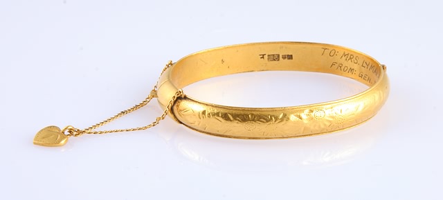 Appraisal: KY solid gold hinged bangle Safety chain with heart charm