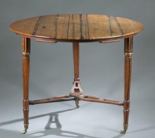 Appraisal: Round tiger maple table with married stretcher A round tiger