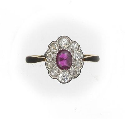 Appraisal: A ruby and diamond cluster ring Set in gold Size