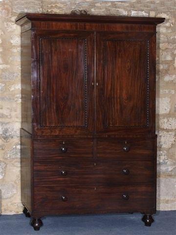 Appraisal: AN EARLY TH CENTURY MAHOGANY LINEN PRESS with cavetto moulded