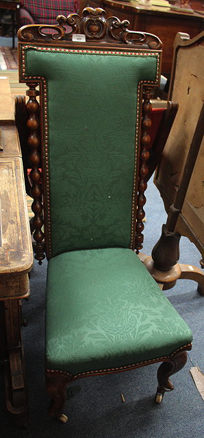 Appraisal: A VICTORIAN WALNUT HIGH BACK CHAIR with spindle supports the